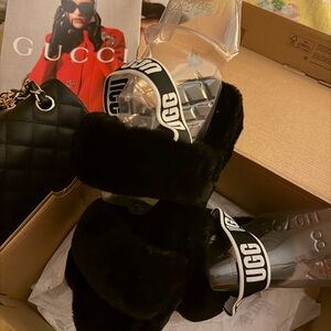 UGG Black and Tan Fluffy Sandals
